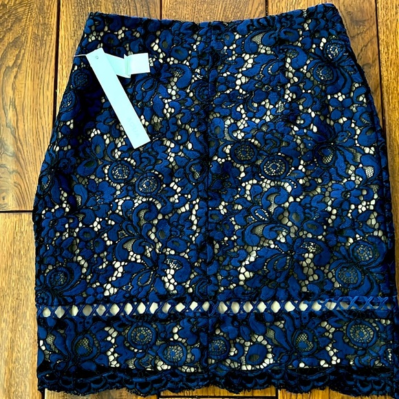 SALE! NWT Aqua Navy Lace Lined Mini Skirt. Side Zipper lingerie straps - Picture 2 of 4